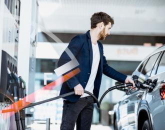 Man Filling Gas Tank on Vehicle